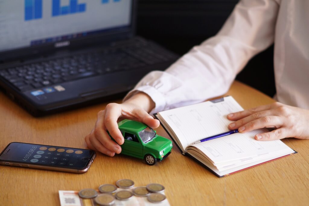 Closeup shot of a person thinking of buying a new car or selling a vehicle